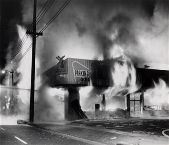 (FIRE) A collection of approximately 37 large photographs depicting tense, heated scenes of firefighters and pedestrians attempting to